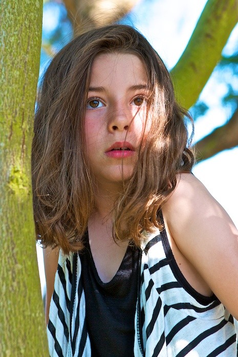 Little girl in tree by Marla Meridith