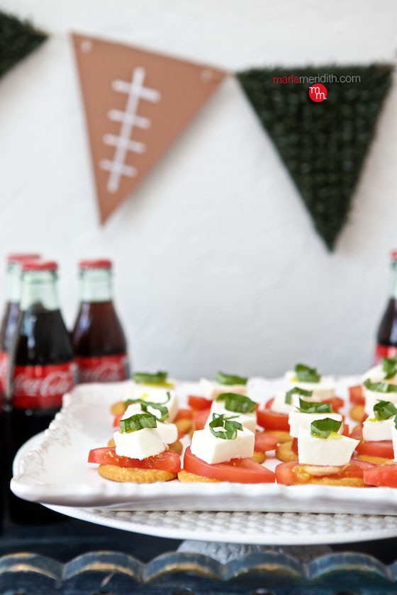 RITZ Caprese Top everyone's favorite snack RITZ crackers with traditional caprese ingredients: mozzarella, fresh tomato, basil and a balsamic drizzle. Relish! MarlaMeridith.com ( @marlameridith )