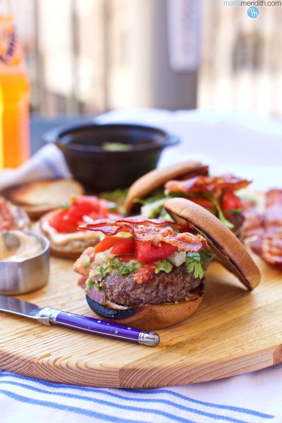 Pile on that crispy bacon, homemade guacamole, fresh pico de gallo & slather on the Lemon Chipotle Mayo. Get the recipe for these TEX-MEX BURGERS on marlameridith.com