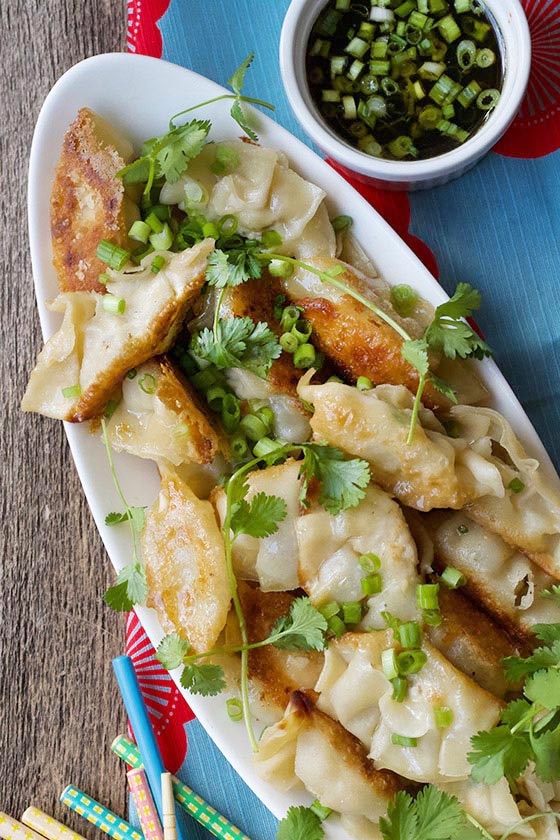 These Ginger Chicken Potstickers are better than anything you can get in a restaurant! Make this simple & delicious recipe today! MarlaMeridith.com