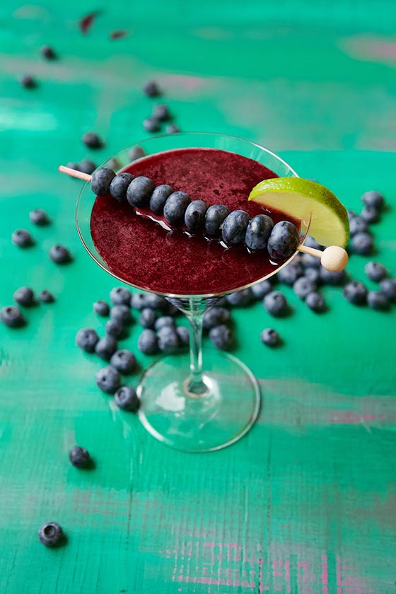 This Blueberry Cosmopolitan Cocktail recipe is a simply delicious creation with fresh blueberries, lime juice, vodka and St. Germain. MarlaMeridith.com