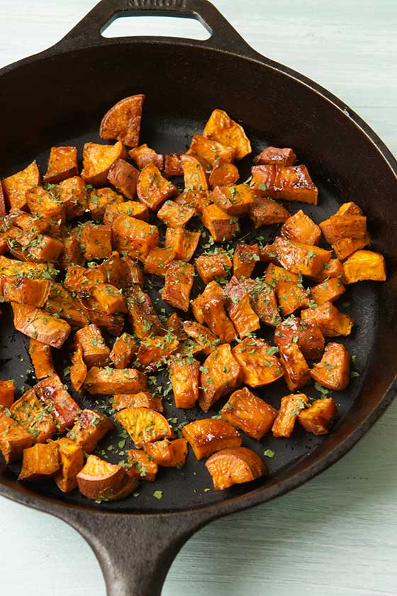 A favorite side dish for fall & winter, this Maple Cinnamon Skillet Roasted Sweet Potatoes recipes is simple, healthy and delicious! MarlaMeridith.com