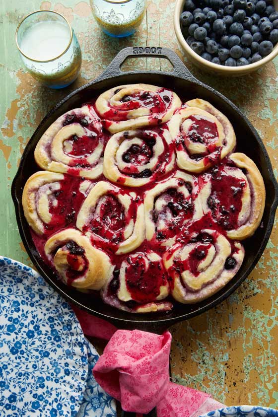 Everyone will love these Delicious Cast-Iron Skillet Blueberry Sweet Rolls. The recipe is super simple and the homemade sweet roll dough is a must! MarlaMeridith.com
