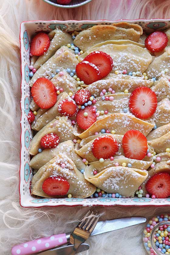 This is quite possibly the BEST breakfast/brunch recipe ever! Show off your cooking skills with this easy Strawberry Cream Cheese Crepe Casserole recipe. MarlaMeridith.com