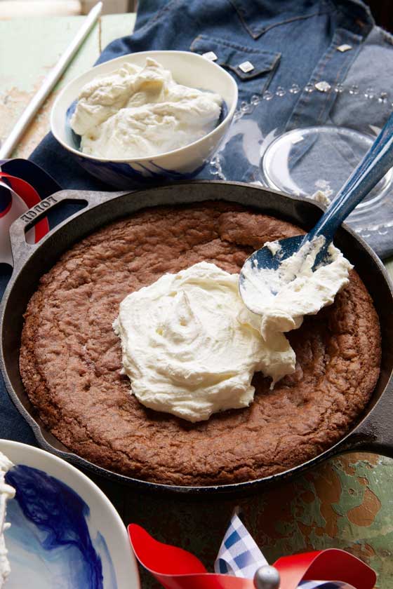 This easy & delicious Skillet Brownie with Maple Whipped Cream recipe is great for any kind of entertaining, potluck parties or any time you want a sweet chocolatey treat! MarlaMeridith.com