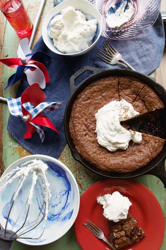 This easy & delicious Skillet Brownie with Maple Whipped Cream recipe is great for any kind of entertaining, potluck parties or any time you want a sweet chocolatey treat! MarlaMeridith.com