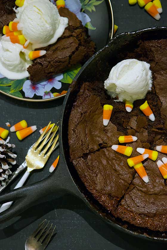 Melted Candy Corn Skillet Brownie recipe: A delicious way to use up that leftover Halloween candy! These brownies are chewy and irresistible. MarlaMeridith.com