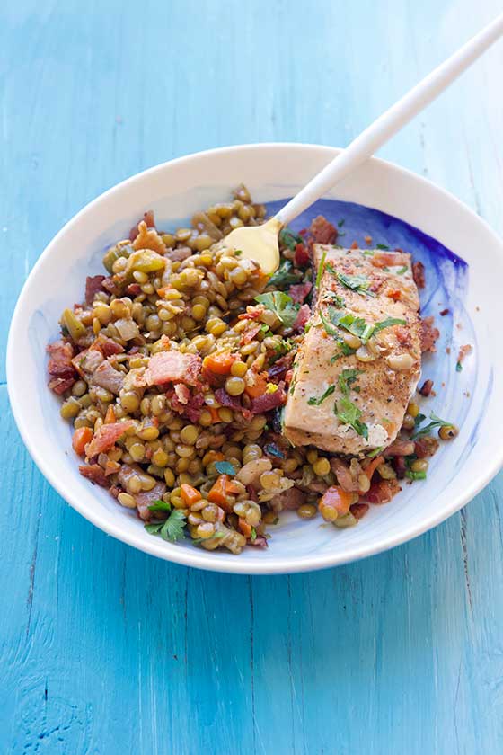 This gluten-free, healthy Skillet Salmon with Bacon & Lentils is protein packed and completely delicious! Perfect for family dinners and for entertaining guests. MarlaMeridith.com