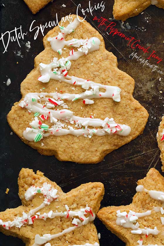 Dutch Speculaas Cookies with Peppermint Crunch Icing. Delicious traditional, thin, crisp, dark-brown cookies that originate from the Netherlands. They are extra satsifying with the festive icing! Serve for Christmas and holiday gatherings. MarlaMeridith.com