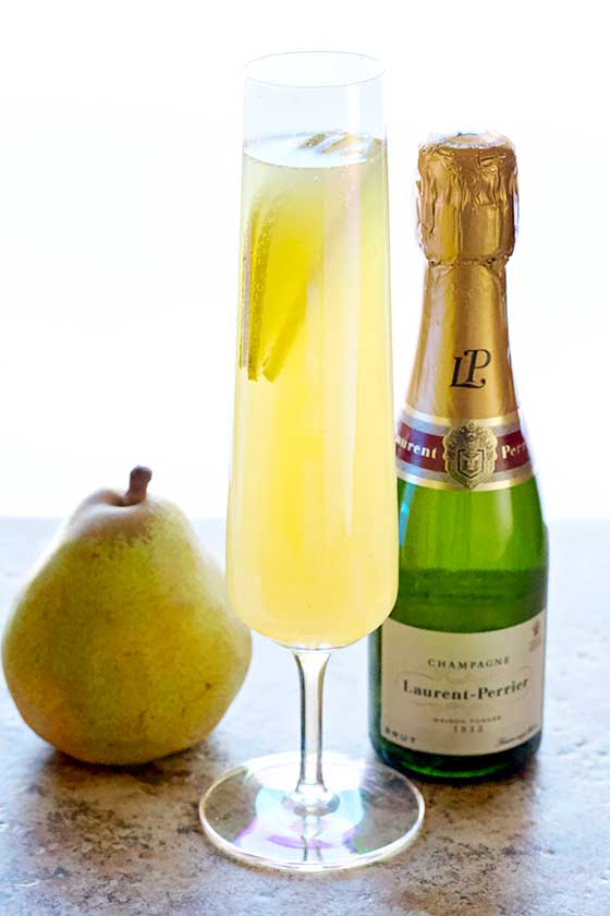 Ring in the New Year with this Sparkling Pear Champagne Cocktail recipe. It's quenching and delicious, simply to prepare for any occasion! MarlaMeridith.com